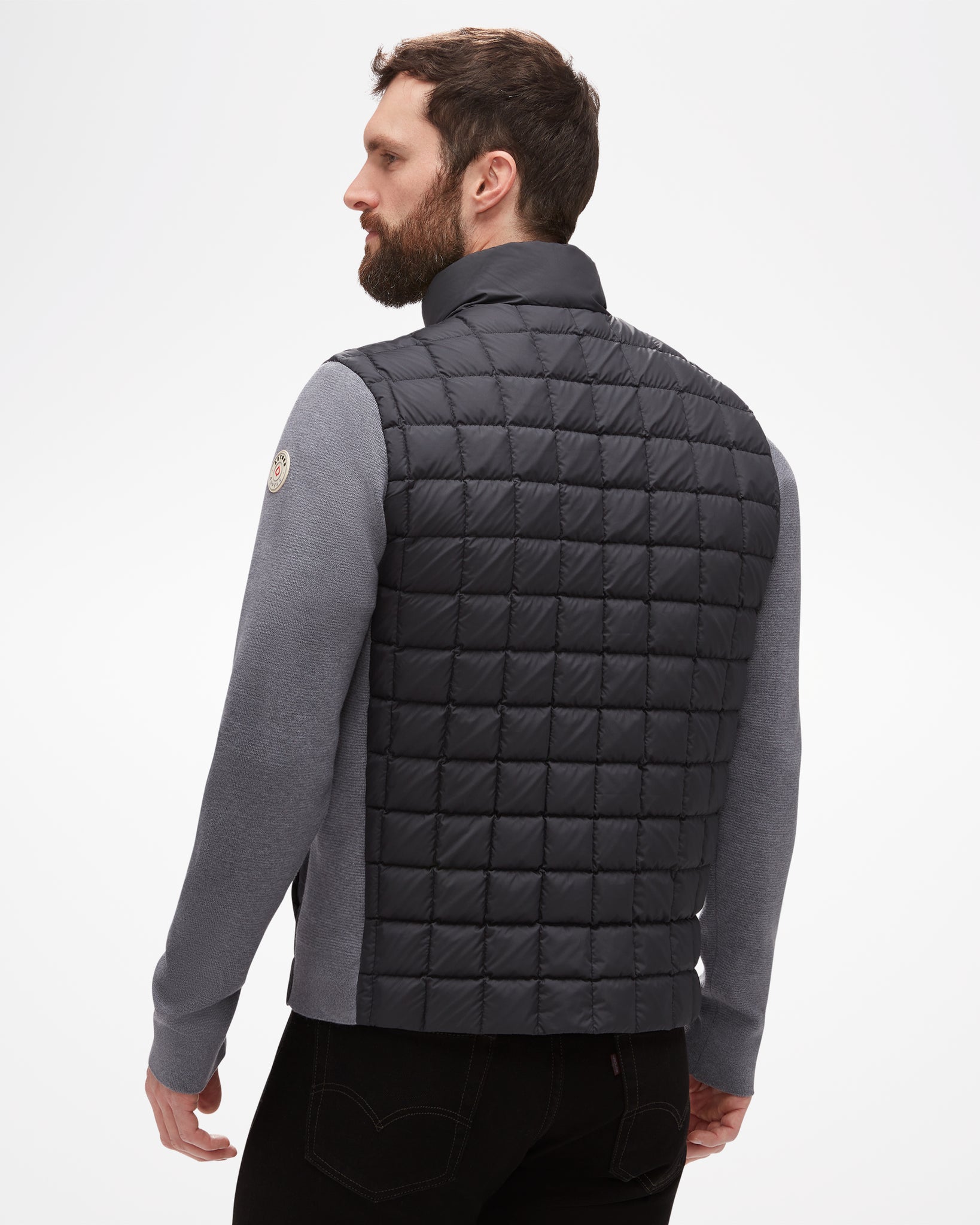 Aspen Collection Aether Phase Men's Full Zip Jacket, view from back. Black puffer fabric on back of jacket