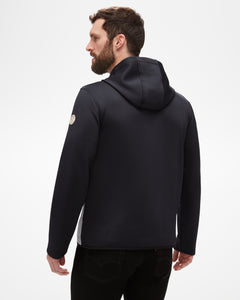 Aspen Collection Men's Aether Morgan Technical Fleece Hoodie, from the back. Black athletic fabric, patch on shoulder and large hood to protect from the elements