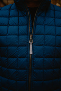 Aspen Collection Aether Phase Men's Full Zip Jacket, close up on blue puffer detail on jacket.