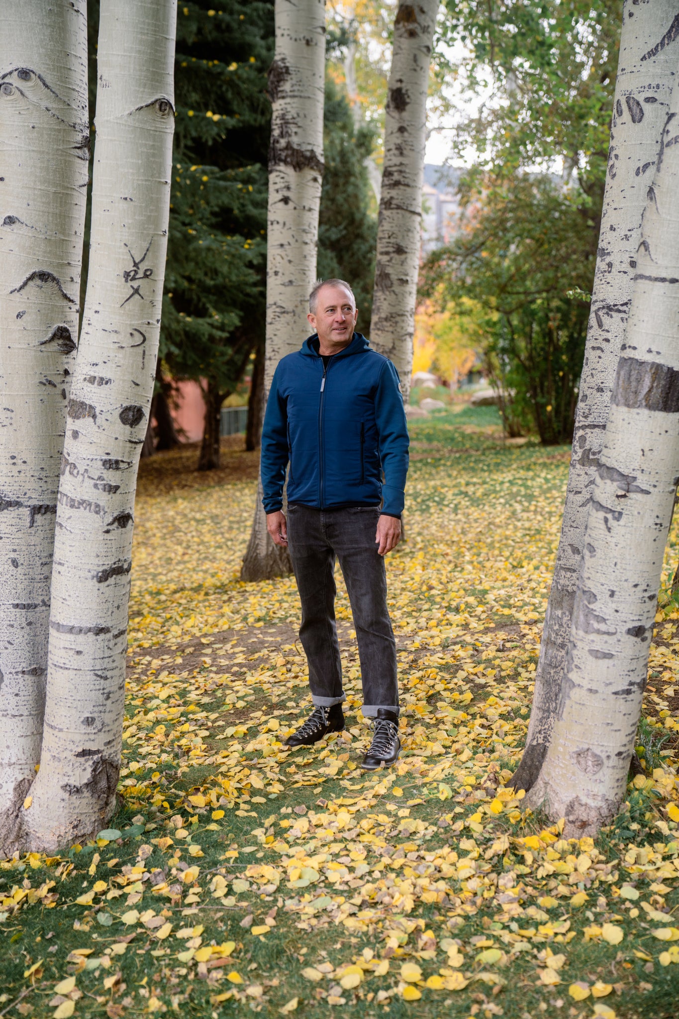 Aspen Collection Aether Morgan Technical Fleece Hoodie, in blue. Lifestyle shoot to show full jacket fit.