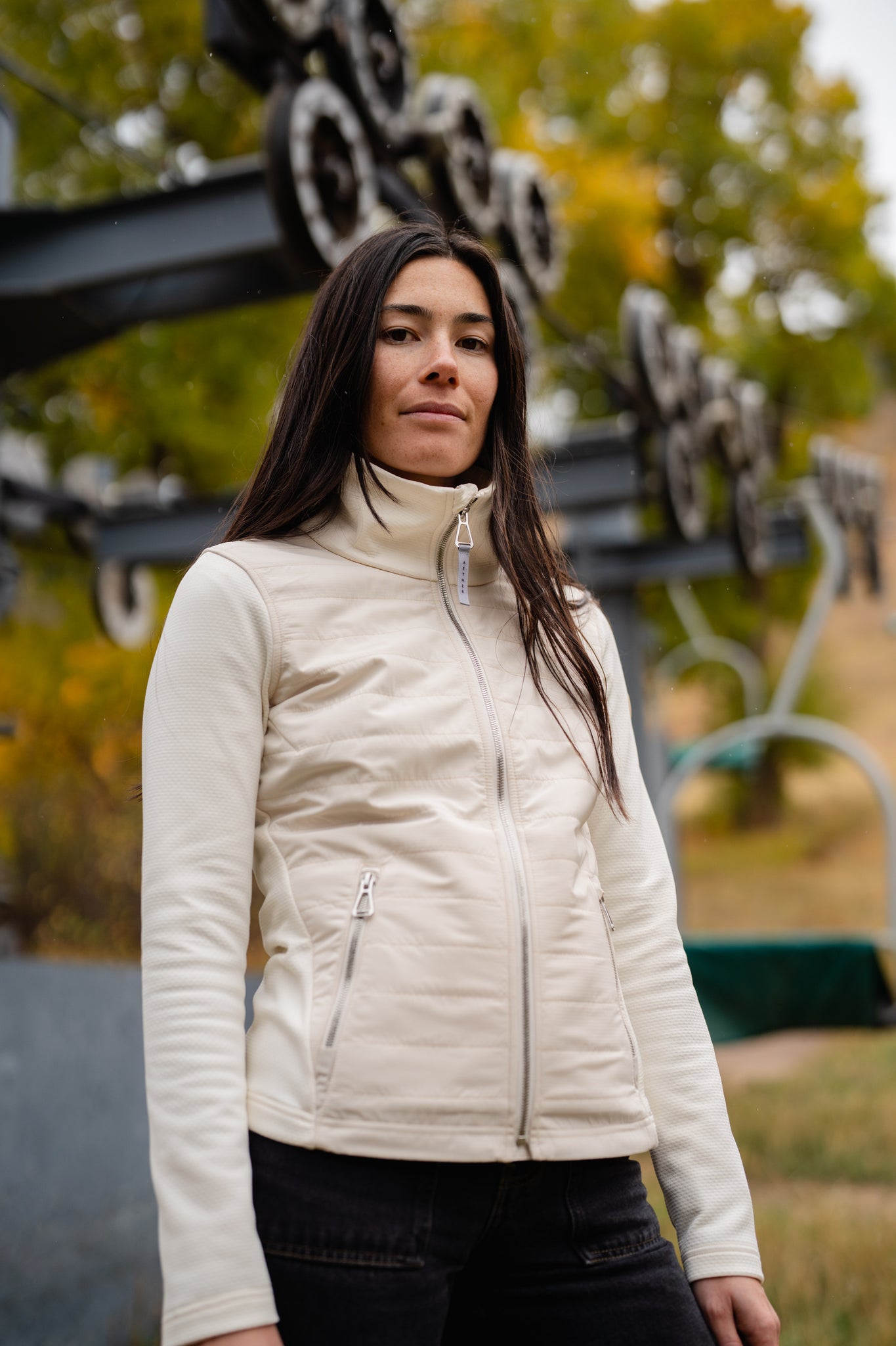 Aspen Collection Aether Morgan Technical Fleece Jacket, white color, on model in lifestyle shoot. Front view.