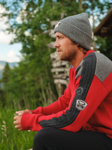 Aspen Ullr Men's Sweater in Radiant Red Lifestyle Photo with Patches