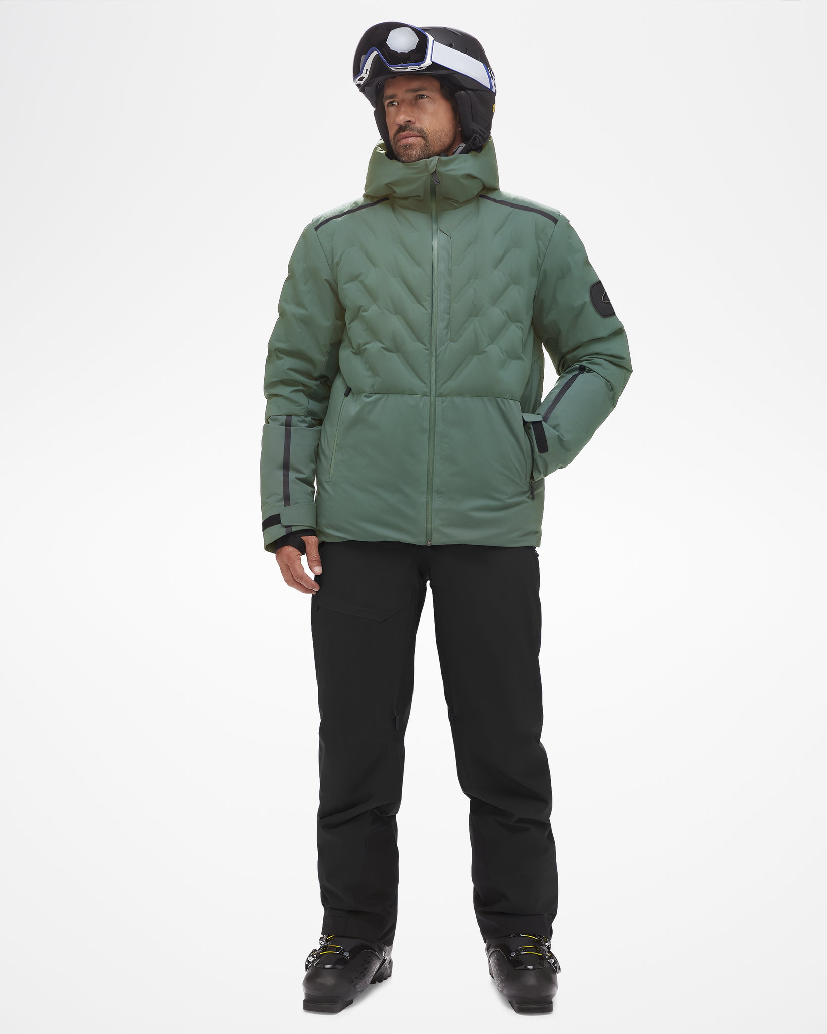 Full body view of men's powerline jacket, modeled with full ski gear