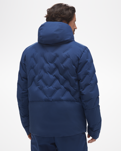 back view of powerline jacket, in blue. Worn with matching snow pants