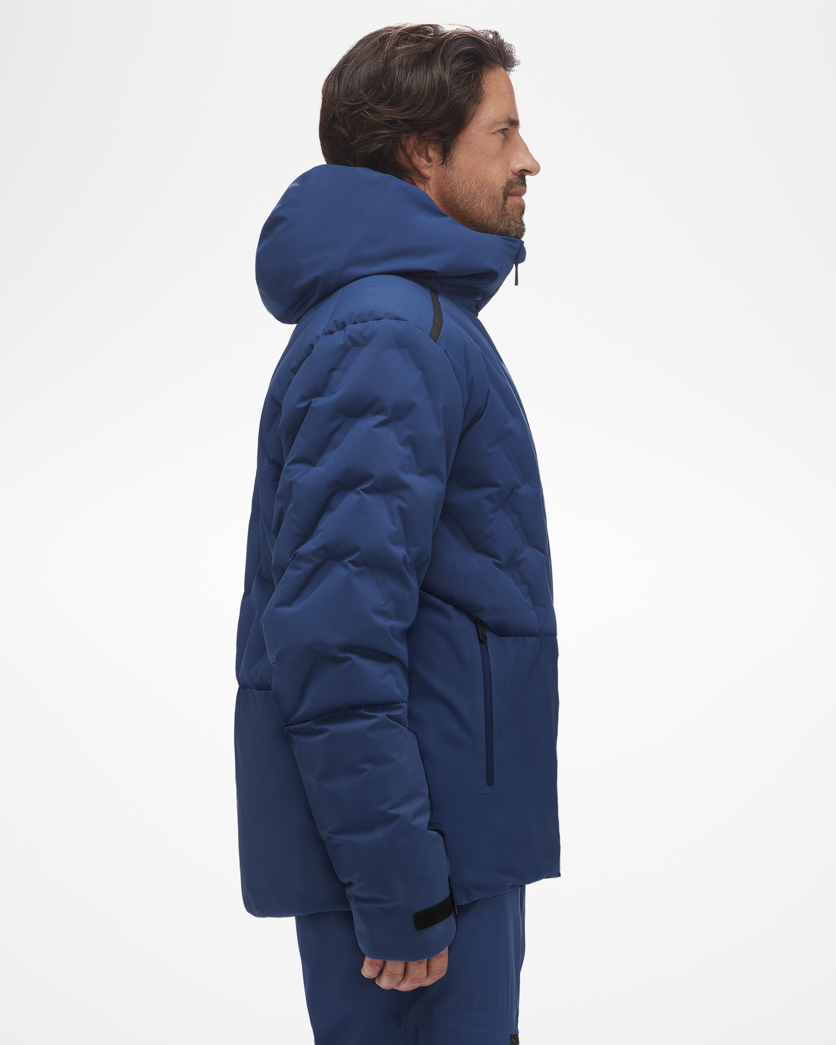 Side view of Aspen Collection powerline jacket, in blue. This jacket is thick, and perfect for cold days on the slope, designed for outdoor wear