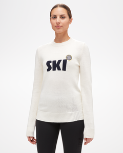 Women's Ski Sweater by Aspen Collection, white merino wool with black "ski" text and snowflake patch