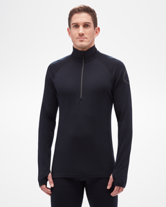 Aspen Collection men's mid layer top, made from merino wool. Black, quarter zip, form fitting with discrete black leaf logo on left arm- front view