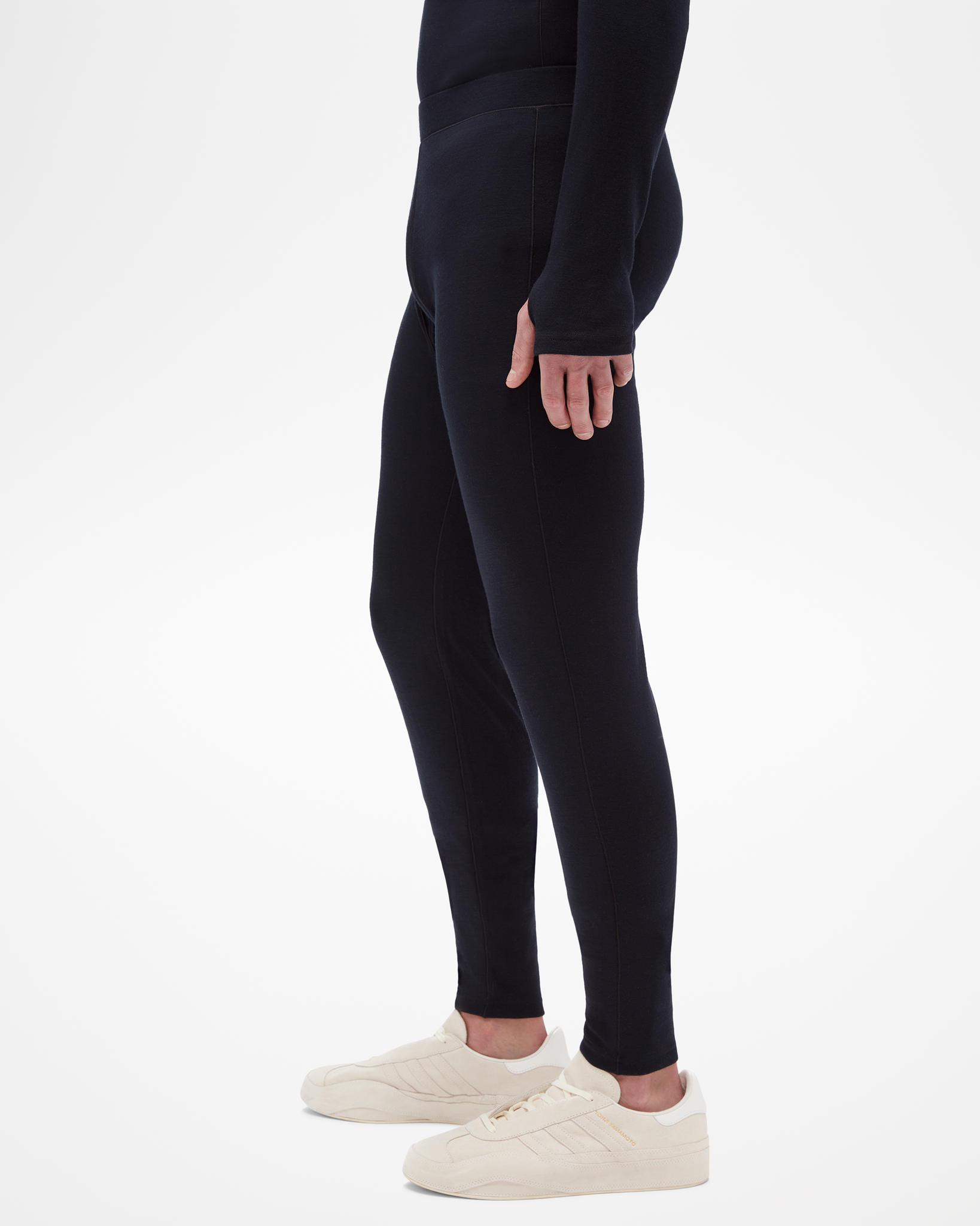 Aspen Collection men's mid layer bottoms, made from merino wool. Side view, black and form fitting  for the ideal mid layer for outdoor activities 