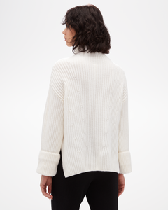 Women's Aspen Collection Cashmere Funnel Neck Sweater, loose white knit with side slit and cuffed sleeve, in all white, back view of model