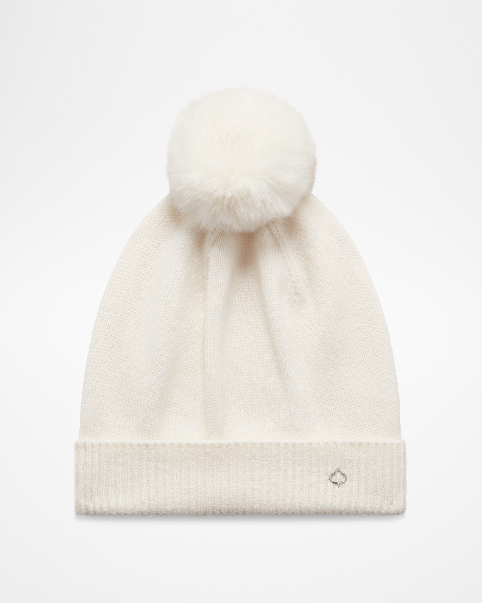 Cashmere POM Beanie by aspen collection, all white with white pom on top, small silver leaf logo on cuff, front view